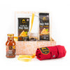 Gourmet gift set with SIAM Pad Thai noodles kit, sauce, and red towel on a white background