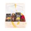 Packaged food kit with noodles, sauce, and utensils on a white background